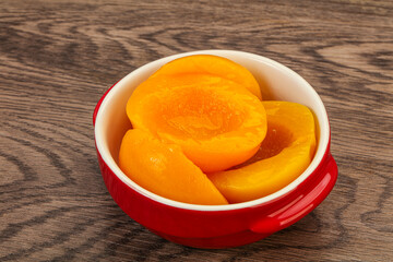 Marinated peaches fruit in the bowl