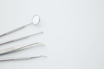 Basic dentist tools isolated on white background. Dental health and teethcare concept.