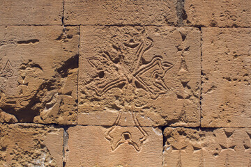 carved cross on the wall of the church
