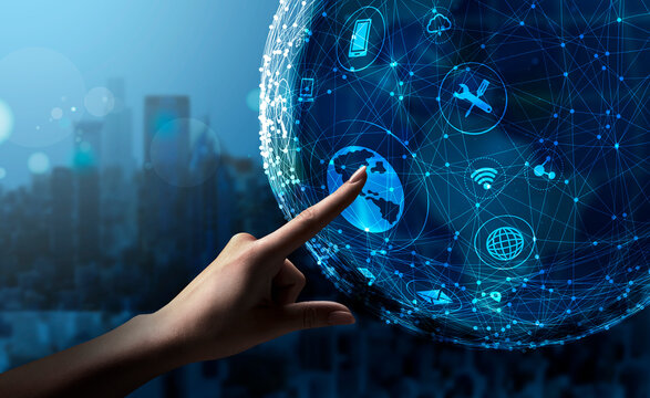 Female Hand Touching Holographic Globe Pushing Button On Blue Background - Powered by Adobe