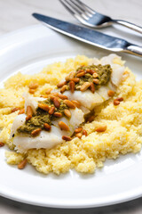 cod with green pesto and pine seeds with couscous