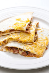 quesadilla filled with beans and chedar cheese