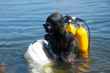 A river diver cleans the bottom of the river from debris. Environmental Protection. Ecology