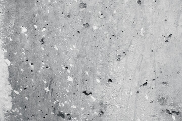 Concrete wall with white putty stains. Abstract gray texture
