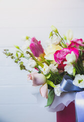 Beautiful bouquet of flowers on white background. Roses, eustoma and tulips. Stylish present for all holidays. Happy birthday gift. Mother's day postcard. Spring mood.