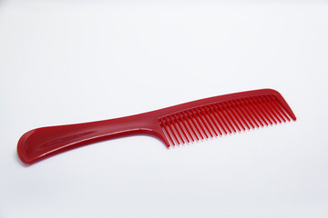 Plastic comb suitable for short and long haircuts, designed not to scratch the scalp or damage hair