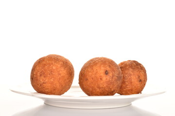 Fresh aromatic, cheese donuts, close-up, on a white background.