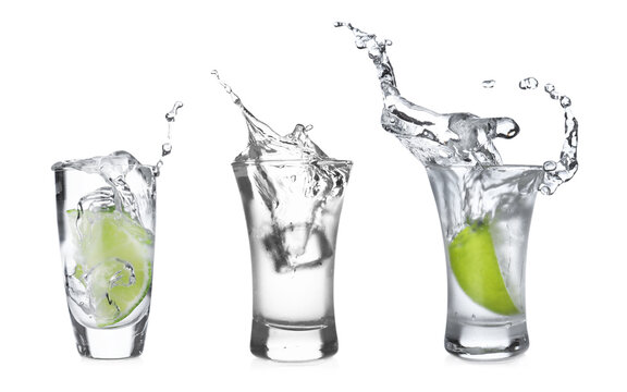 Set with shots of vodka on white background