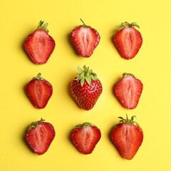 Tasty ripe strawberries on yellow background, flat lay