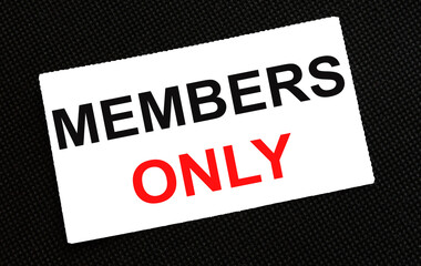 White card on the black background with text Members Only