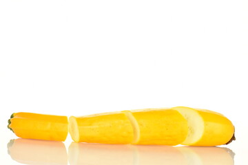 Fresh ripe, bright yellow zucchini, close-up, on a white background.