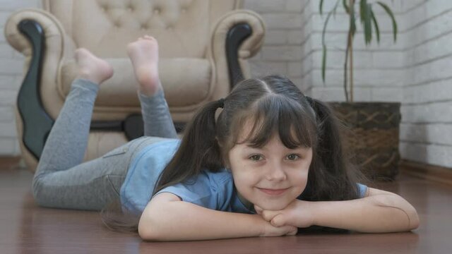 Sporty child on the floor.