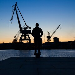 Cranes at Stenpiren at sunset in Gothenburg, Sweden