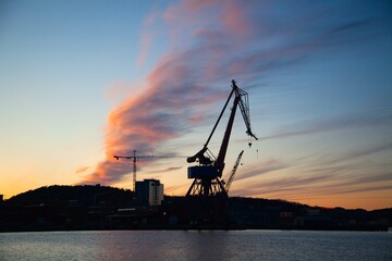 Cranes at Stenpiren at sunset in Gothenburg, Sweden