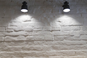 white brick wall with lamps