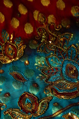 blue-red fabric with golden embroidery. Orient, Indian, Asian, Arabic style