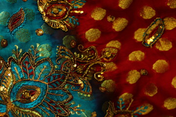 Fototapeta premium blue-red fabric with golden embroidery. Indian style.