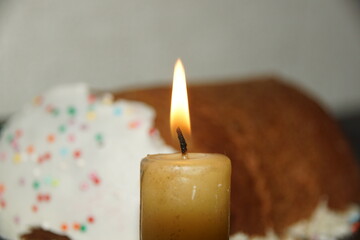 burning candle on a dark background