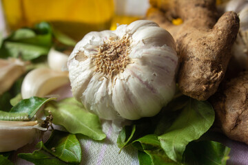 View of commonly used in ingredient (garlic, ginger and curry leaves) in south Indian cooking. Foods that help boost immunity in natural way.