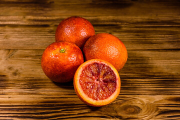 Ripe sicilian oranges on a wooden table