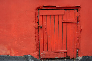 small wooden barn door with a lock