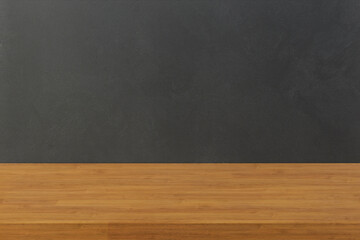 Empty wooden table and dark colour wall background.