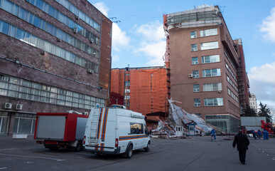 A car of the Ministry of emergency situations at the site of scaffolding collapsed from a strong wind near a reconstructed multi-storey building in the city center.