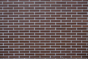 Wall made of red bricks placed horizontally