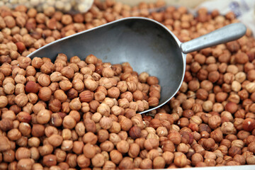 Dry nuts in the stock with metallic spoon to take