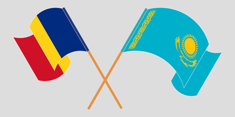 Crossed and waving flags of Kazakhstan and Romania