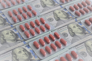 medicine concept, straight rows of blisters and dollar bills, medical business, pharmaceutical background