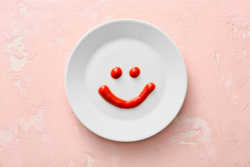 Happy face made of sauce on plate