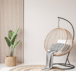 Rattan swing with green plant and rattan basket on wooden interior background, wall mockup