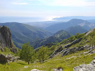 Fototapeta na wymiar panorama towards the horizon among the wooded valleys on the Apuan Alps of the Tuscan Apennines