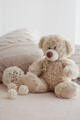 Vintage Teddy bear on a bed.