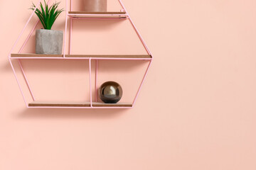 Stylish shelf with decor on color background