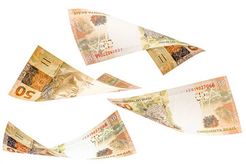 fifty reais banknotes from Brazil falling on isolated white background. Concept of falling money, devaluation of the real or financial crisis.