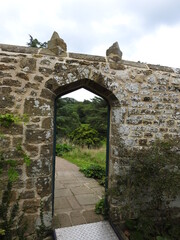 Old free-standing wall with a passage in the wall