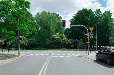 Red traffic light at a crossroads