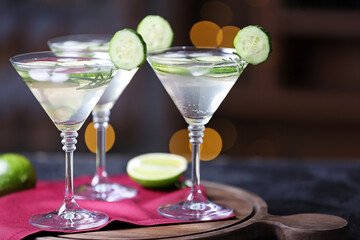 Glasses of tasty cucumber martini on table in bar
