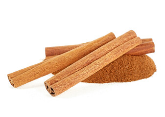 Heap of ground cinnamon and cinnamon sticks isolated on a white background. Cassia.