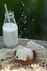 Bottle of milk and coconut marmalade. They pour it on top.
