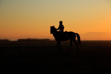 Silhouette view of a horseman at sunset. Cappadocia, Turkey