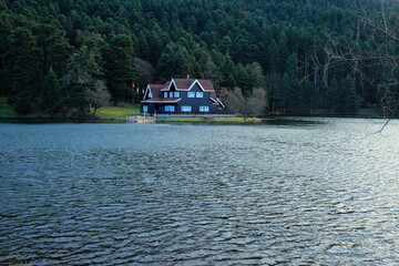 Fototapeta premium Golcuk nature park and a wooden lake house on the shore. Bolu, Turkey