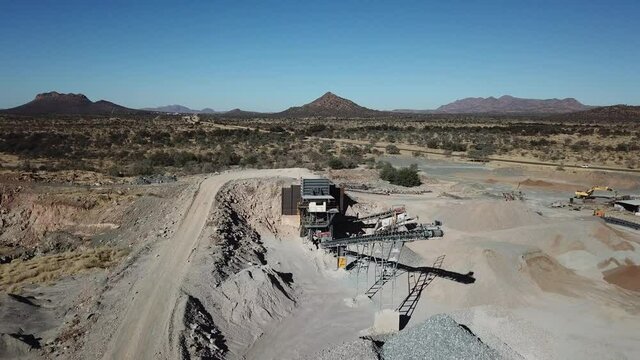 4K aerial drone video of African savanna hills, stone quarry near granite boulders range at B1 highway south of Windhoek in central highland Khomas Hochland of Namibia, southern Africa