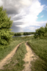 Field in the road among the hills. Landscape in nature in the reserve in the park. Stock photo background