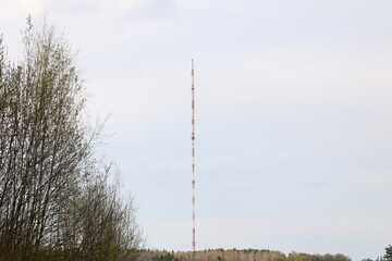 a four hundred meter television radio tower stands in the middle of the forest