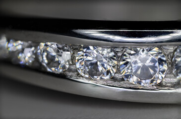 Detail of clear diamonds on a white gold ring.