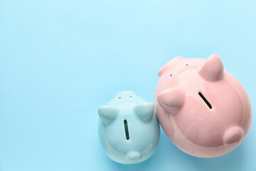 Piggy banks on color background