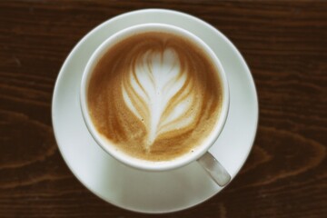 cup of cappuccino on a wood table